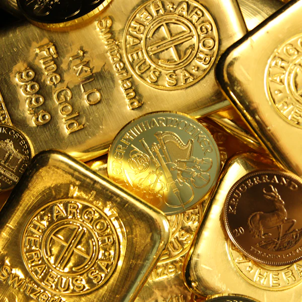 Stamped gold bars and bullion coins piled together